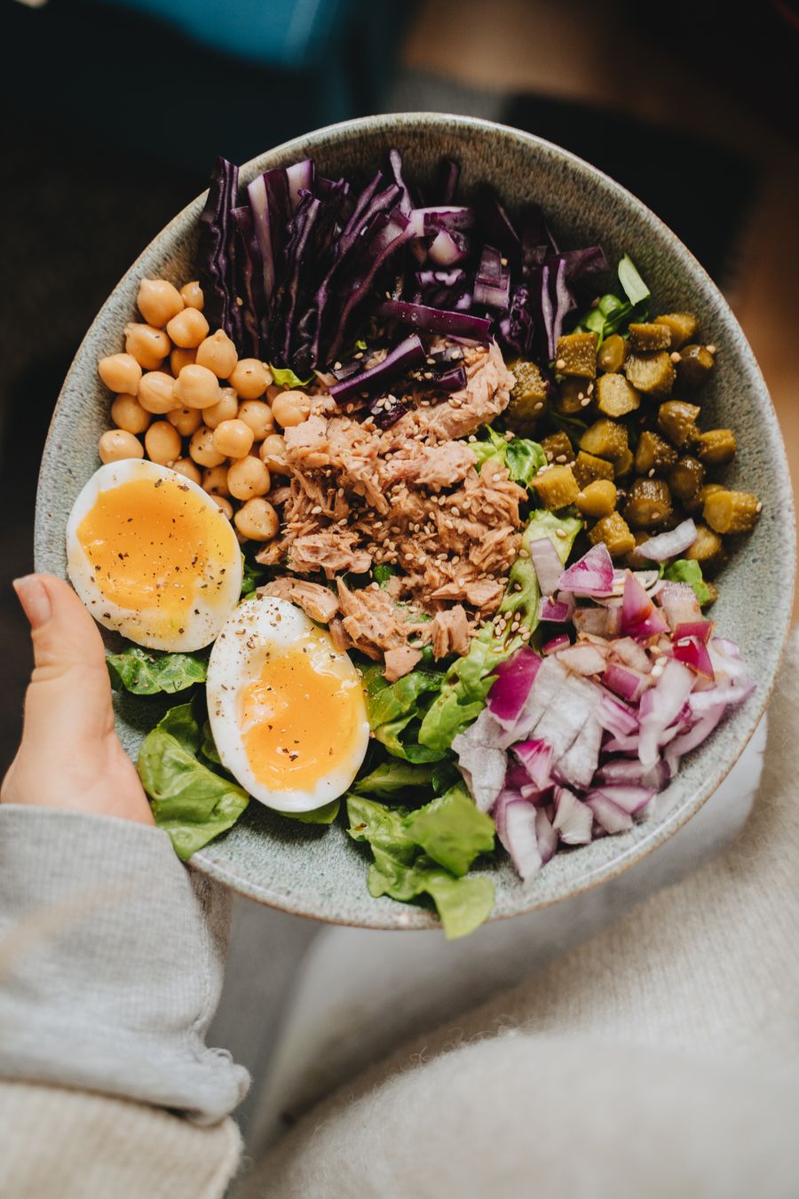 Bowl of tuna, boiled eggs, chickpeas, and vegetables