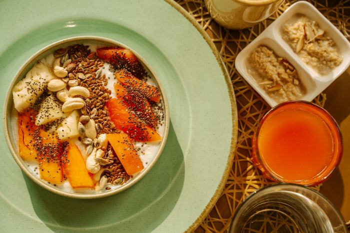 Breakfast bowl with yogurt, fruit, and seeds