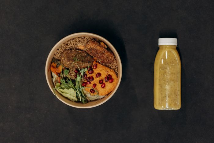 Vegan bowl with quinoa, vegetables, and a smoothie